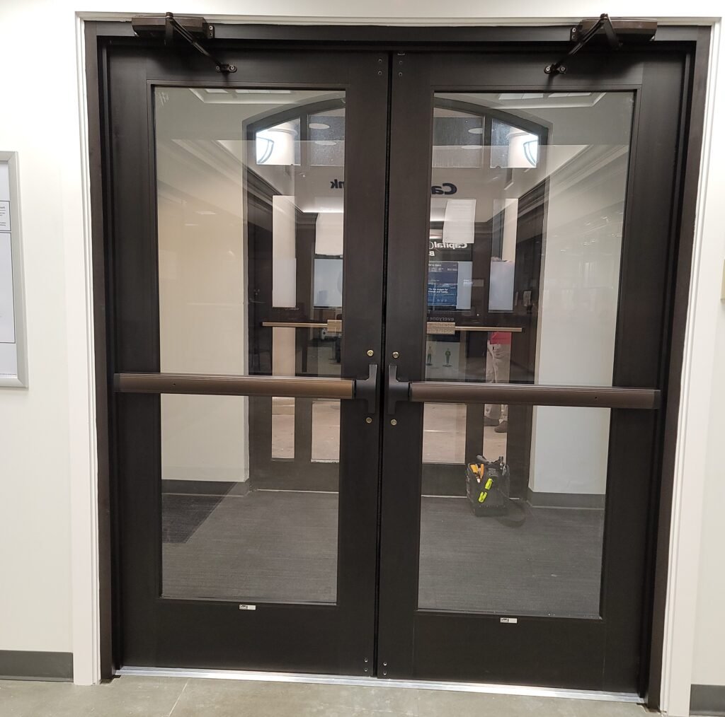 Black-framed commercial glass double doors