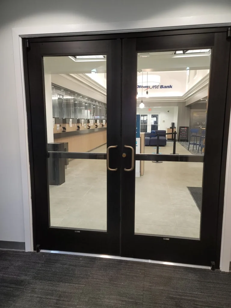 Black-framed glass doors at a commercial lobby