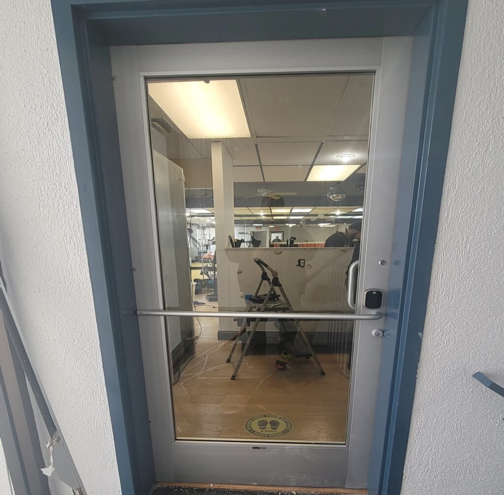 Glass office door with push bar