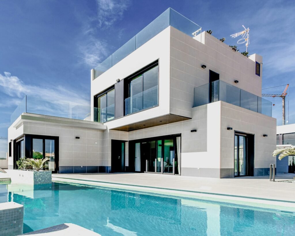 Modern home with glass railings and sliding glass doors