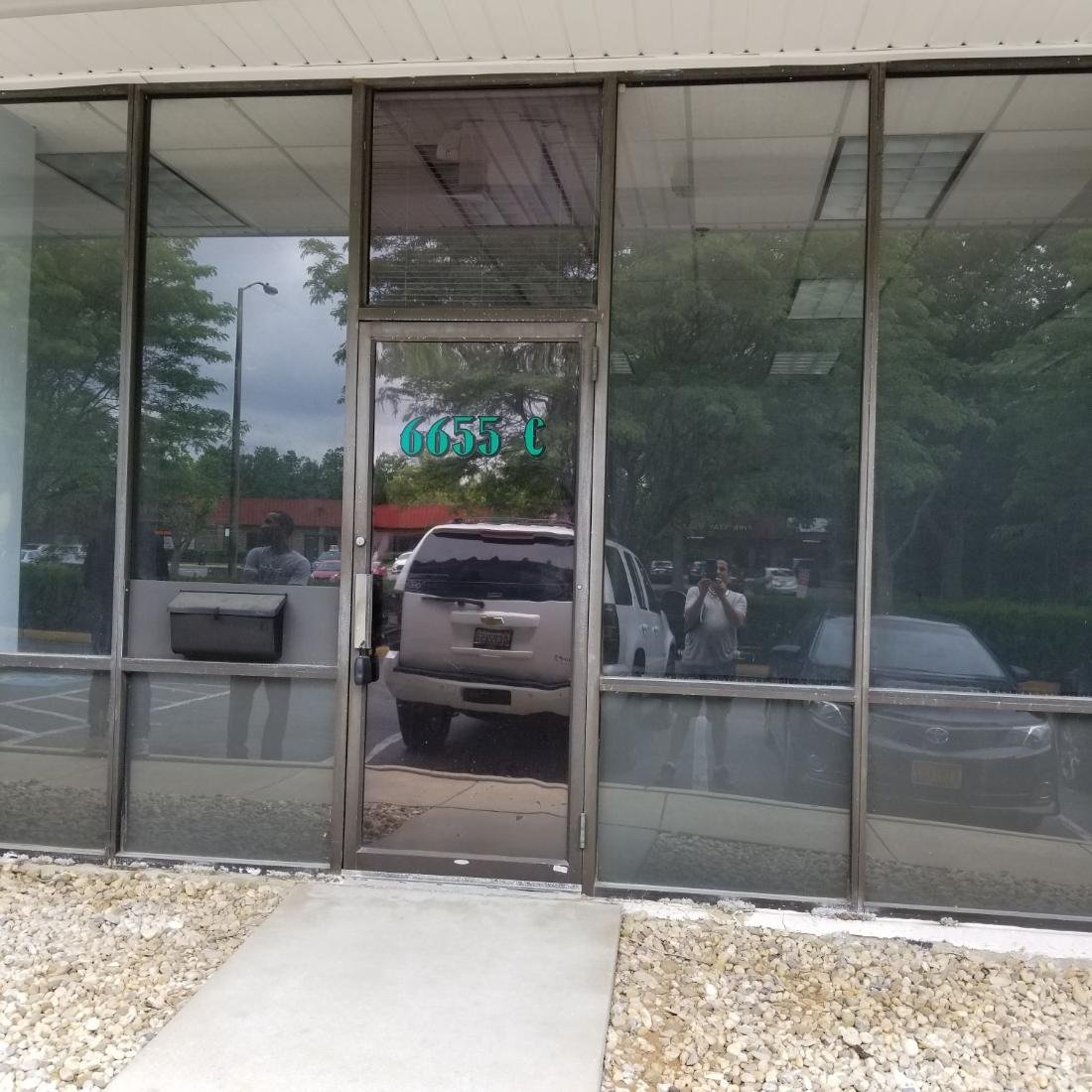 Storefront secured and repaired after broken glass